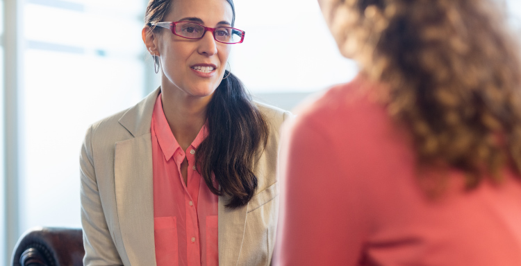 A clinical mental health counselor talks with a client.