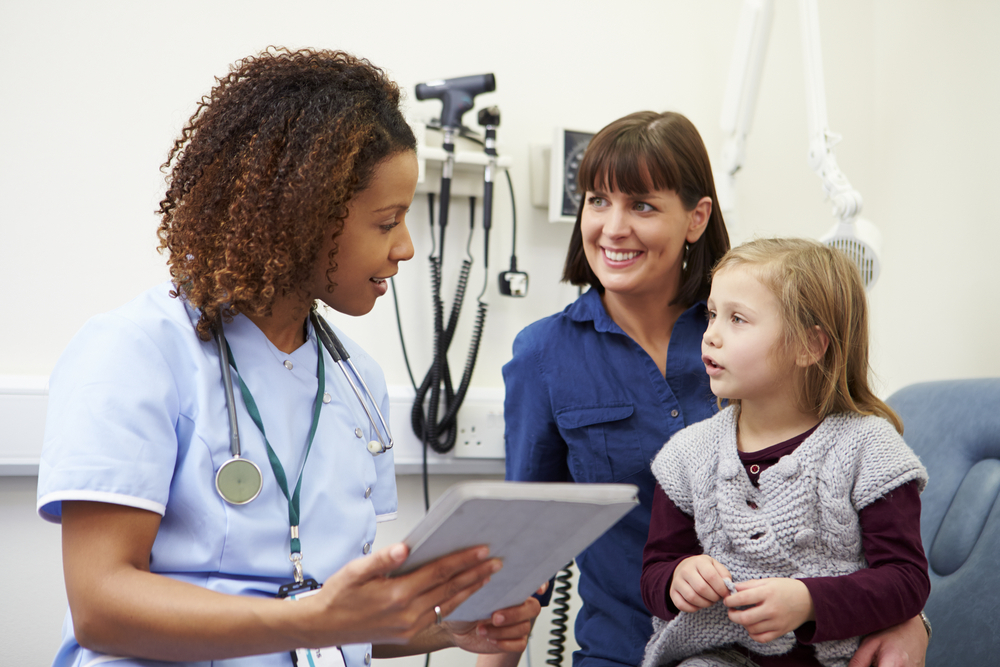 Family nurse with mother and daughter